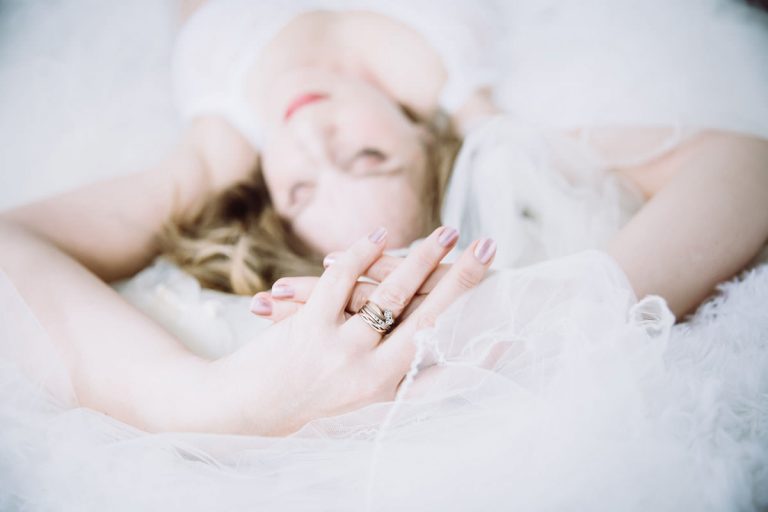 bridal boudoir focusing on engagement ring