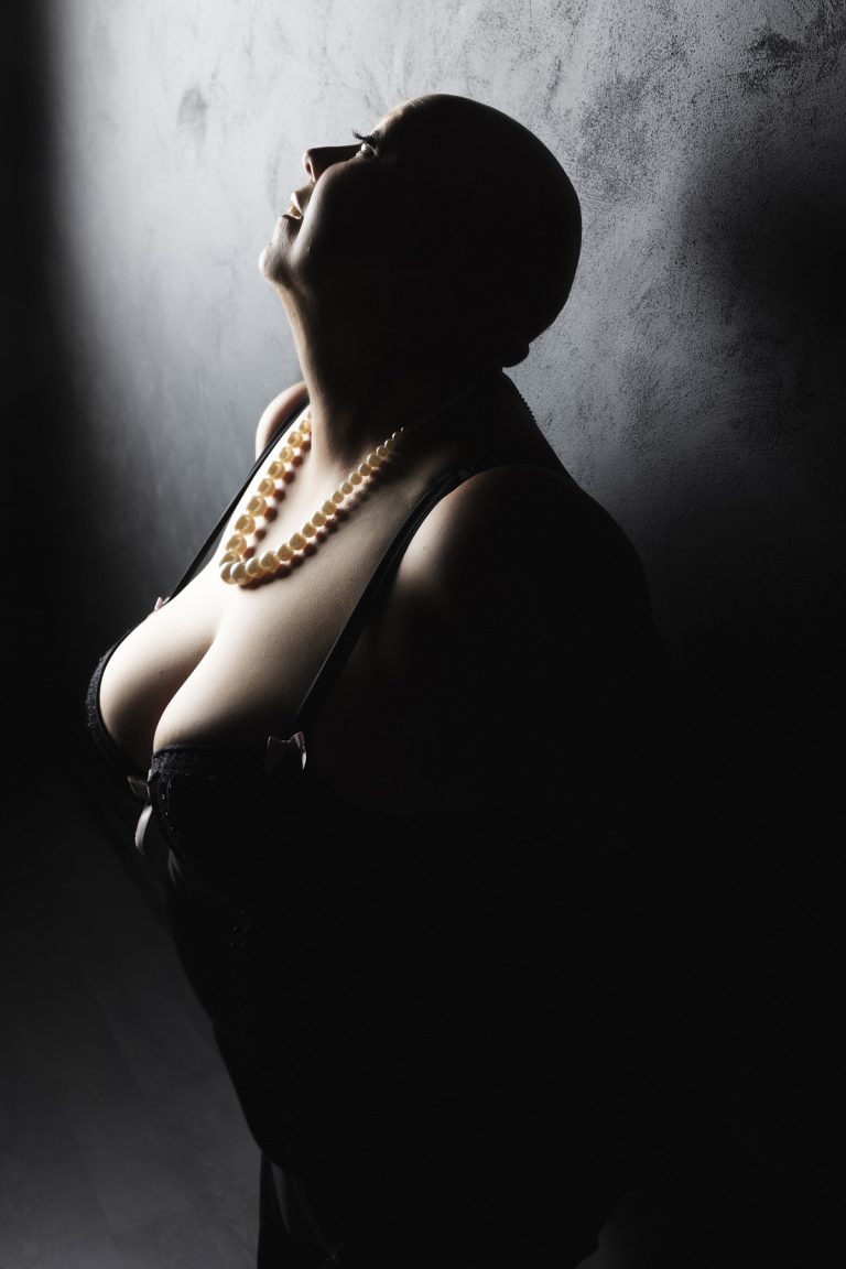 glamorous curvy bald woman