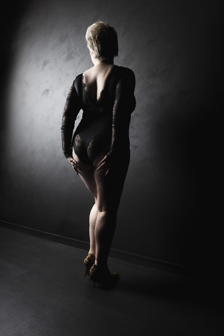 Curvy boudoir image of a woman standing