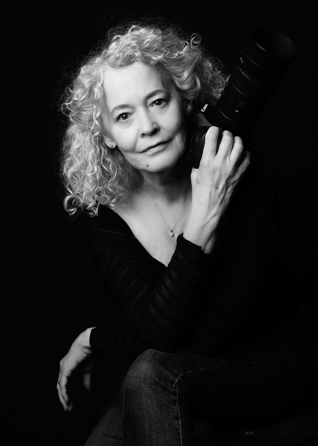 boudoir photographer holding a camera